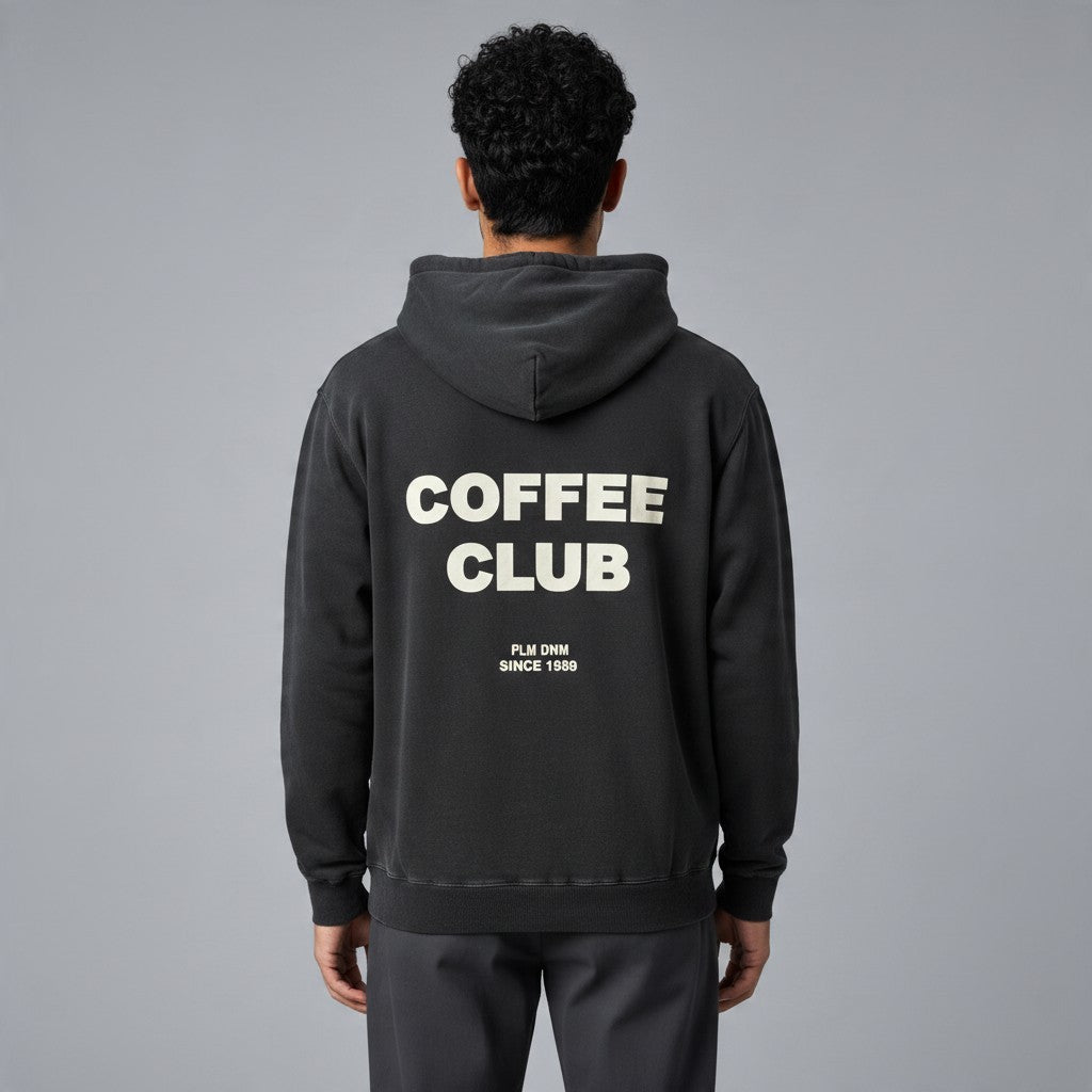 Poolman Oversize-Hoodie in Schwarz mit großem Coffee Club Rückenprint und Kapuze, getragen von einem Mann